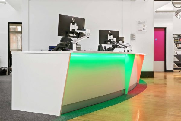 Bespoke Angled Reception Desk with Coloured Downlighting
