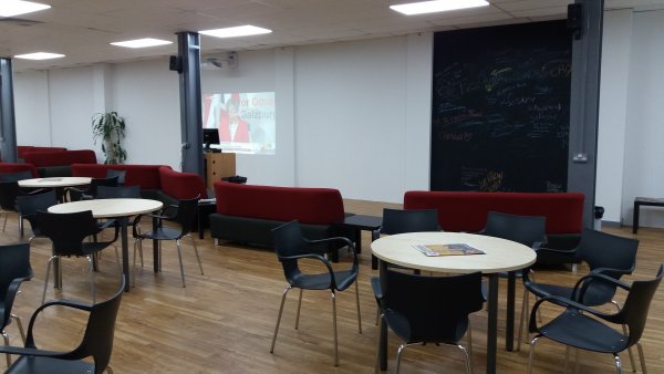 Common Room with Sofas, Tables and Chairs