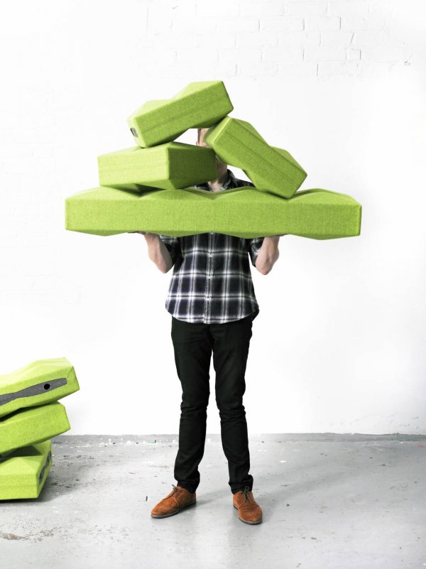 Man Holding Lightweight Acoustic Blocks