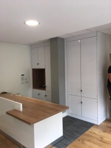 White Gloss REception Desk and Storage Wall