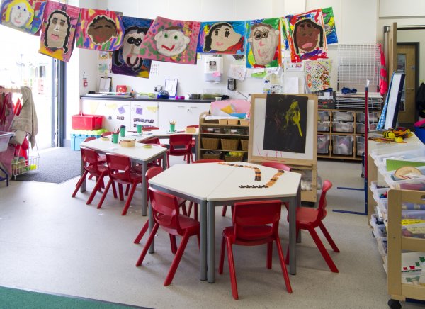 Postura-Plus-Red-Plastic-Classroom-Chairs-In-Nursery-In-Situ