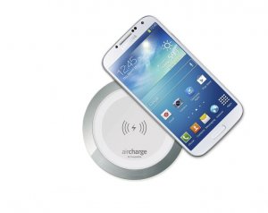 White Aircharge Wireless Surface Charger with Samsung Phone